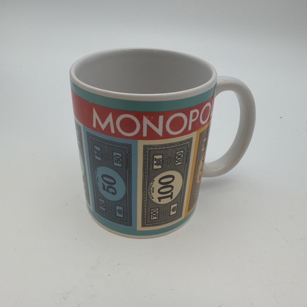 Hasbro Monopoly money coffee mug featuring colorful bill designs
